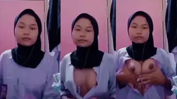 Bokep Indo VCS Hijab Remas Dada Mulus poster